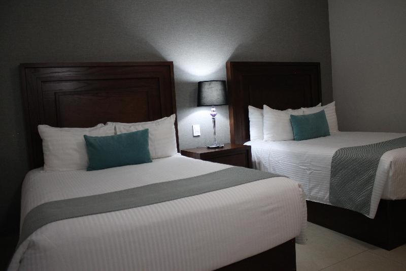 Hotel Suites Mexico Plaza Leon Campestre Номер фото